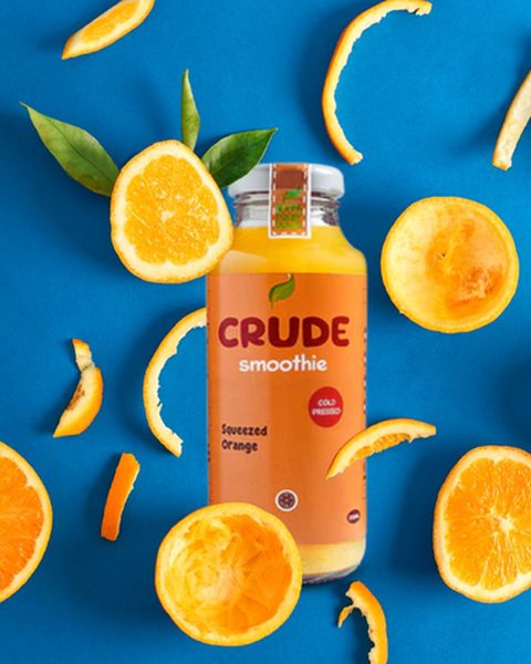 Produktfoto: Orangen-Smoothie zwischen Orangenscheiben
